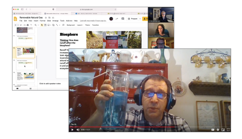 A screenshot of a man with headphones holding up a glass with blue liquid. In the background is a zoom call with a slideset and at least 3 attendees on the right side.